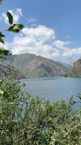 Quiet alpine lake in the Kyrgyz mountains on a clear morning