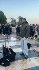 Street performer entertains crowd in Paris public space