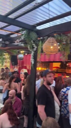 Rooftop party draws young crowd in Munich evening scene