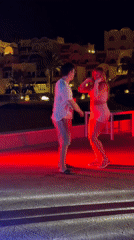 Couple dances outdoors at night in Sharm El Sheikh