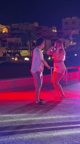 Couple dances outdoors at night in Sharm El Sheikh