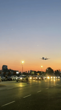 GOL flight lands at dusk as Buenos Aires residents gather