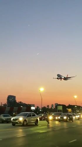 GOL flight lands at dusk as Buenos Aires residents gather