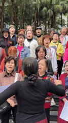 Elderly choir performs outdoor concert in Jiulongpo park