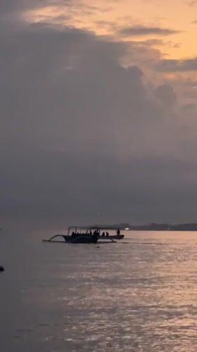 Outrigger boats at dusk on the Buleleng coast