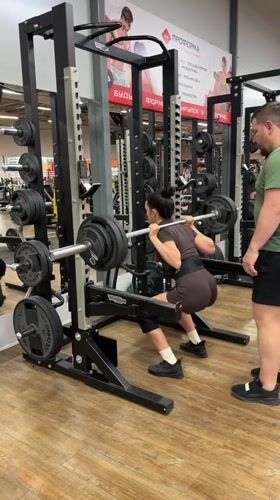 Barbell squats and pull-ups at a Chaikovsky gym
