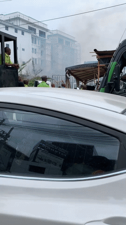 Damaged truck observed amid smoke in Lekki, Nigeria