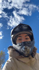Motorcycle riders pose for photos in rural Russian village
