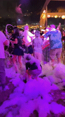 Foam party draws crowds in Chorrillos, Peru early morning