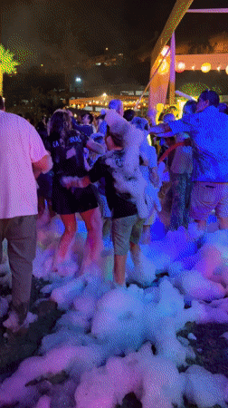Foam party draws crowds in Chorrillos, Peru early morning