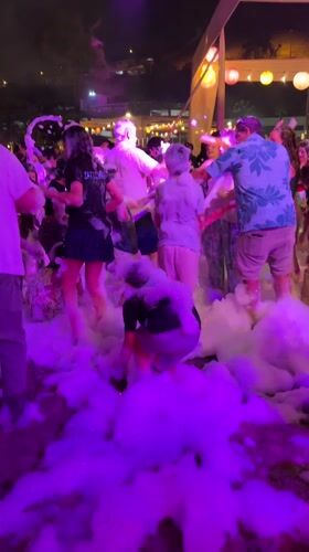 Foam party draws crowds in Chorrillos, Peru early morning
