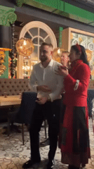 Man dances to accordion music in Sankt-Peterburg restaurant