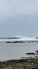 Heavy reef break off General Luna's rocky coastline
