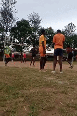 Young adults play informal volleyball game in Turbo, Kenya