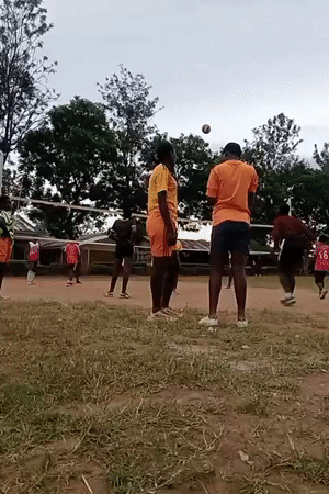 Young adults play informal volleyball game in Turbo, Kenya