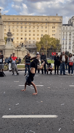 Street breakdancer performs for crowd in Buenos Aires