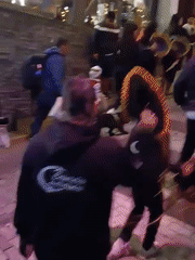 Night street performers and tourists gather in Machupicchu walkways