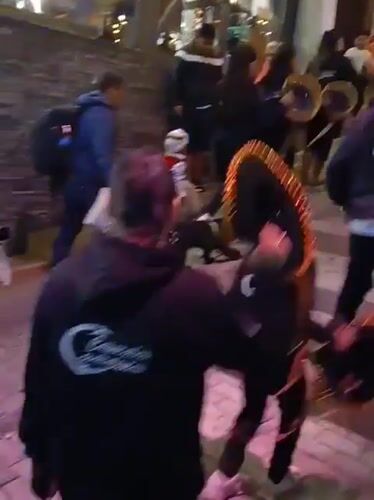 Night street performers and tourists gather in Machupicchu walkways