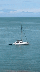 Catamaran anchored in turquoise waters off Ko Samui