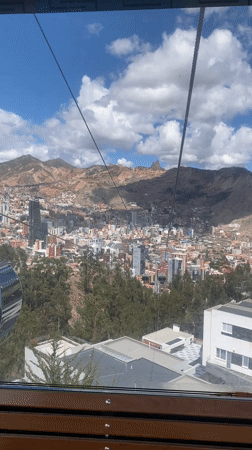 Cable car riders capture aerial views of La Paz cityscape
