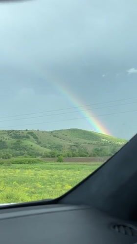 Rainbow appears over Bulgarian countryside near Dolna Malina