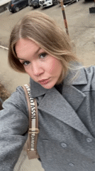 Woman films selfies outdoors in Perm, Russia early morning