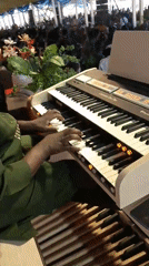 Man plays Connerton Duo Flex organ with hands and feet