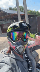 ATV rider documents off-road adventure with selfies and scenery