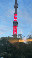 Tourist takes selfie near Moscow's Ostankino Tower in Khimki