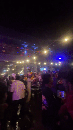 Nighttime outdoor party draws crowds in Lokoja, Nigeria