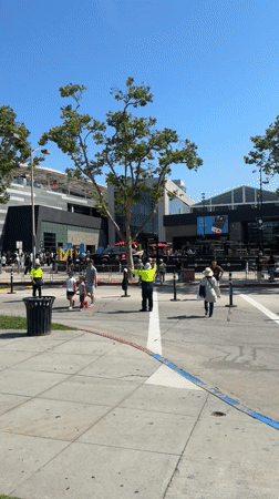 Pedestrians spotted near LA sports venues during clear evening