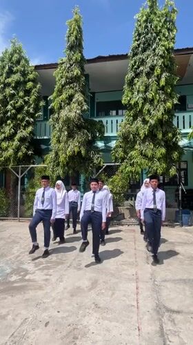 School day scenes at a Lhokseumawe campus, uniforms and all.