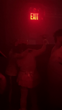 Red-lit nightclub interior captured by witnesses in NYC