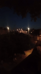 Bastille Day fireworks and crowds along Lyon's Saône