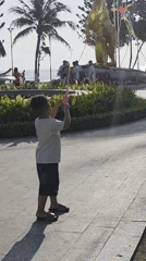 Child flies kite, flower truck procession observed in Nha Trang