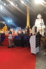 Illuminated outdoor ceremony staged in Mumbai with red carpet