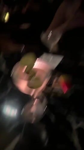 Martini and cigarettes on a black marble bar table