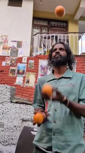 Street performers entertain in Dharamshala area cafes and courtyards