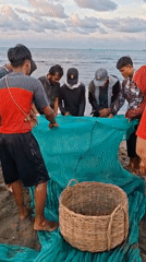 Community fishing operation documented on Lhokseumawe beach, Indonesia