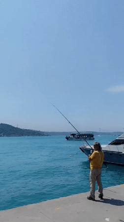 Morning fishing and boating activity along Istanbul's Bosphorus waterfront