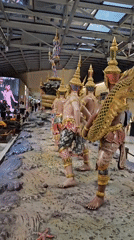 Traditional Thai figures displayed at Thailand airport terminal