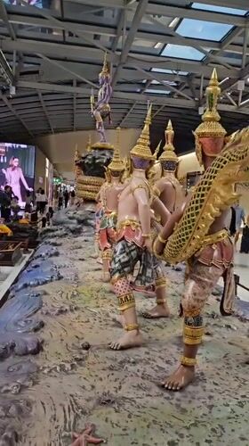 Traditional Thai figures displayed at Thailand airport terminal