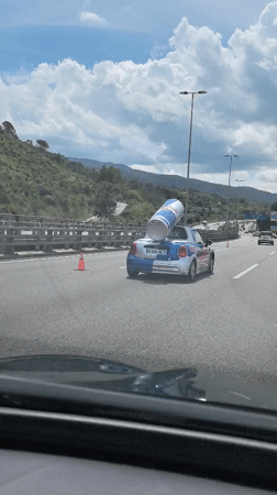 Vehicle follows Red Bull Mini Cooper on Spanish highway