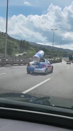 Vehicle follows Red Bull Mini Cooper on Spanish highway