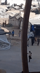 Daily life moves through Khan Yunis camp markets and streets