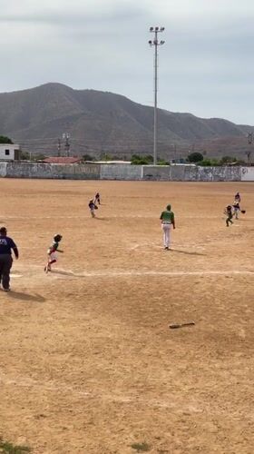 Youth baseball game draws spectators in Juan Griego, Venezuela