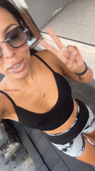 Woman records selfie videos while walking in Kuta Selatan