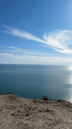Woman takes clifftop selfie overlooking Black Sea near Supsekh