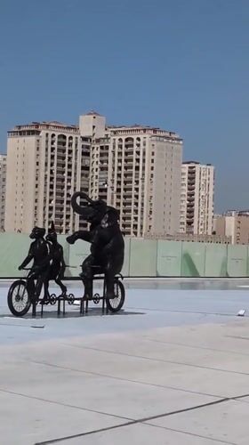 Baku streetscapes mix grand architecture with quirky public sculpture
