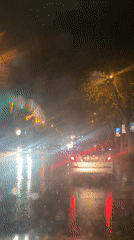 Heavy rain creates wet, reflective streets in Tbilisi